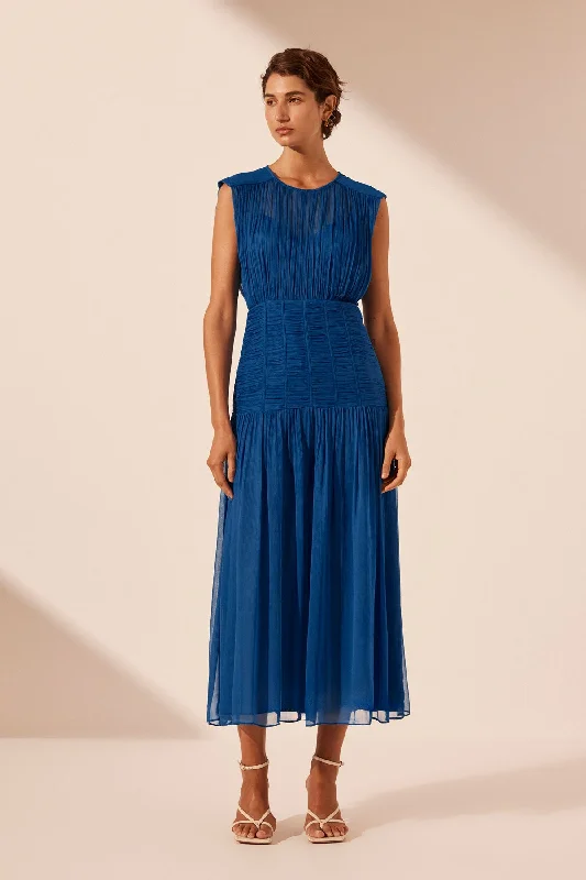 Midi dresses with geometric cutouts for a contemporary and edgy look MAYA RUCHED SLEEVELESS MIDI DRESS - STRONG BLUE Midi dresses with geometric cutouts for a contemporary and edgy look MAYA RUCHED SLEEVELESS MIDI DRESS - STRONG BLUE