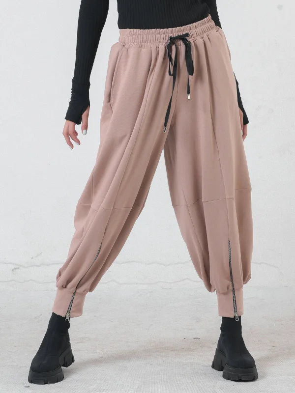 Women's Tight Trousers with Drawstring Waist in Khaki for a Relaxed and Adjustable FitBeige Loose Pants With Zipper Accents Women's Tight Trousers with Drawstring Waist in Khaki for a Relaxed and Adjustable FitBeige Loose Pants With Zipper Accents