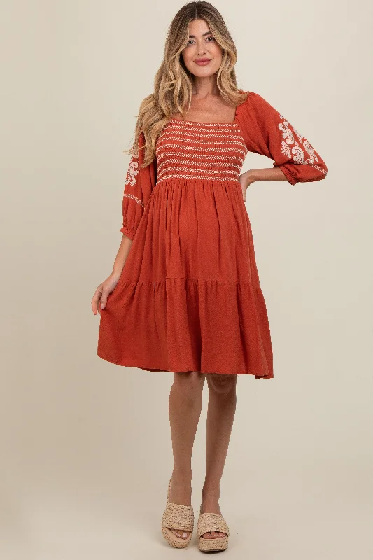 Midi dresses with tiered skirts for a bohemian festival lookRust Smocked Embroidered Damask Maternity Dress Midi dresses with tiered skirts for a bohemian festival lookRust Smocked Embroidered Damask Maternity Dress