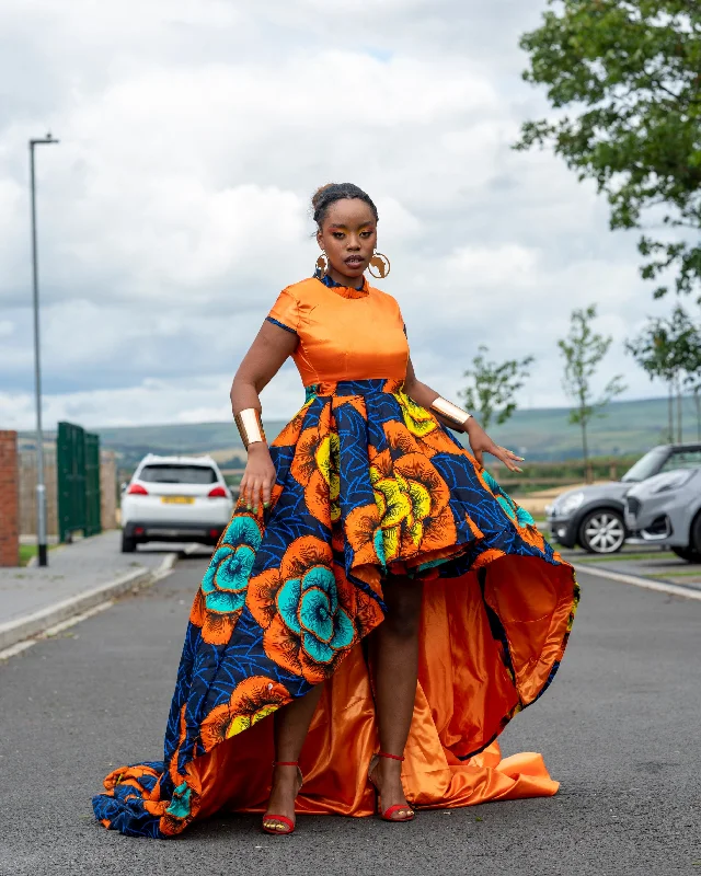 Maxi dresses with pom - pom trims for a playful and festive lookBarbra Ankara High Low Dress | Orange and Blue African Print Maxi dresses with pom - pom trims for a playful and festive lookBarbra Ankara High Low Dress | Orange and Blue African Print